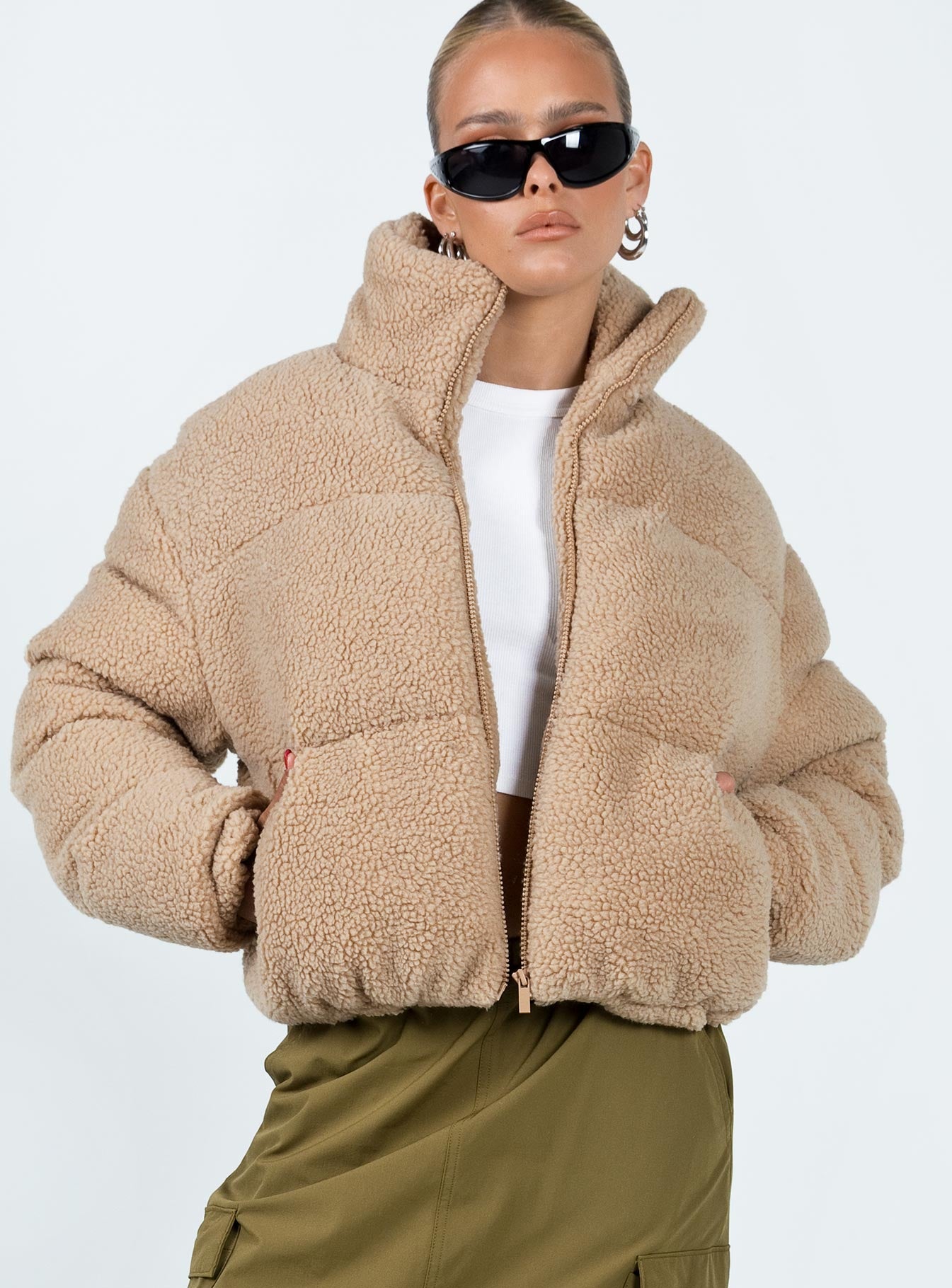 Puffer jacket Sherpa material  Turtle neck Zip fastening at front  Twin hip pockets  Fully lined 