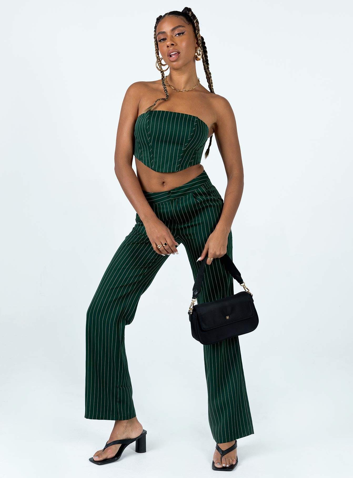 Matching set Pinstripe design Crop top Inner silicone strip Boning throughout Zip fastening at back Straight leg pants Clasp & zip fastening at front Twin hip pockets