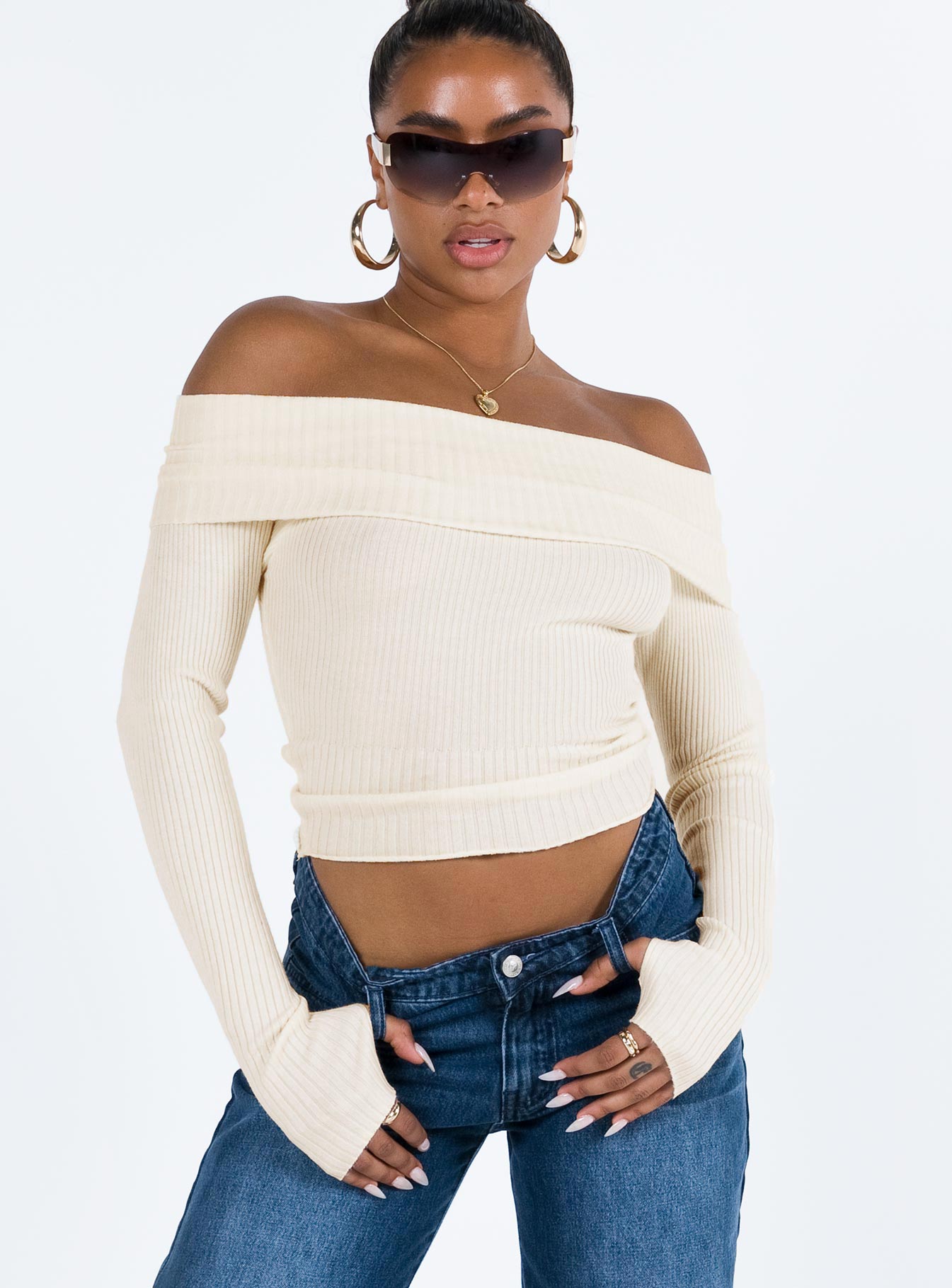 Premium Photo | A woman in a cream off the shoulder top Premium Photo | A woman in a cream off the shoulder top