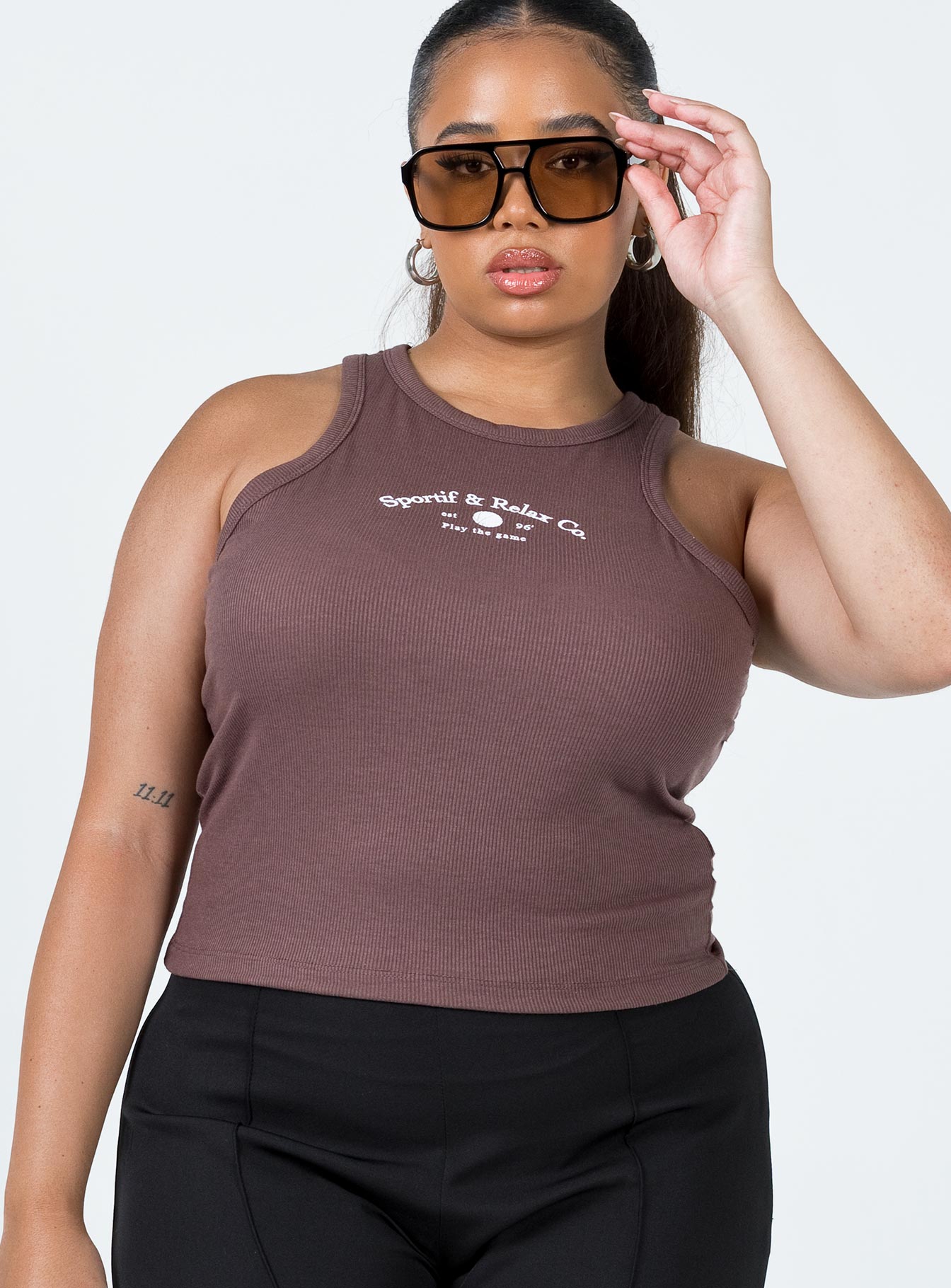 front view of model wearing Princess Polly Play The Game Tank Top Brown Curve Sleeveless Crew Neck 