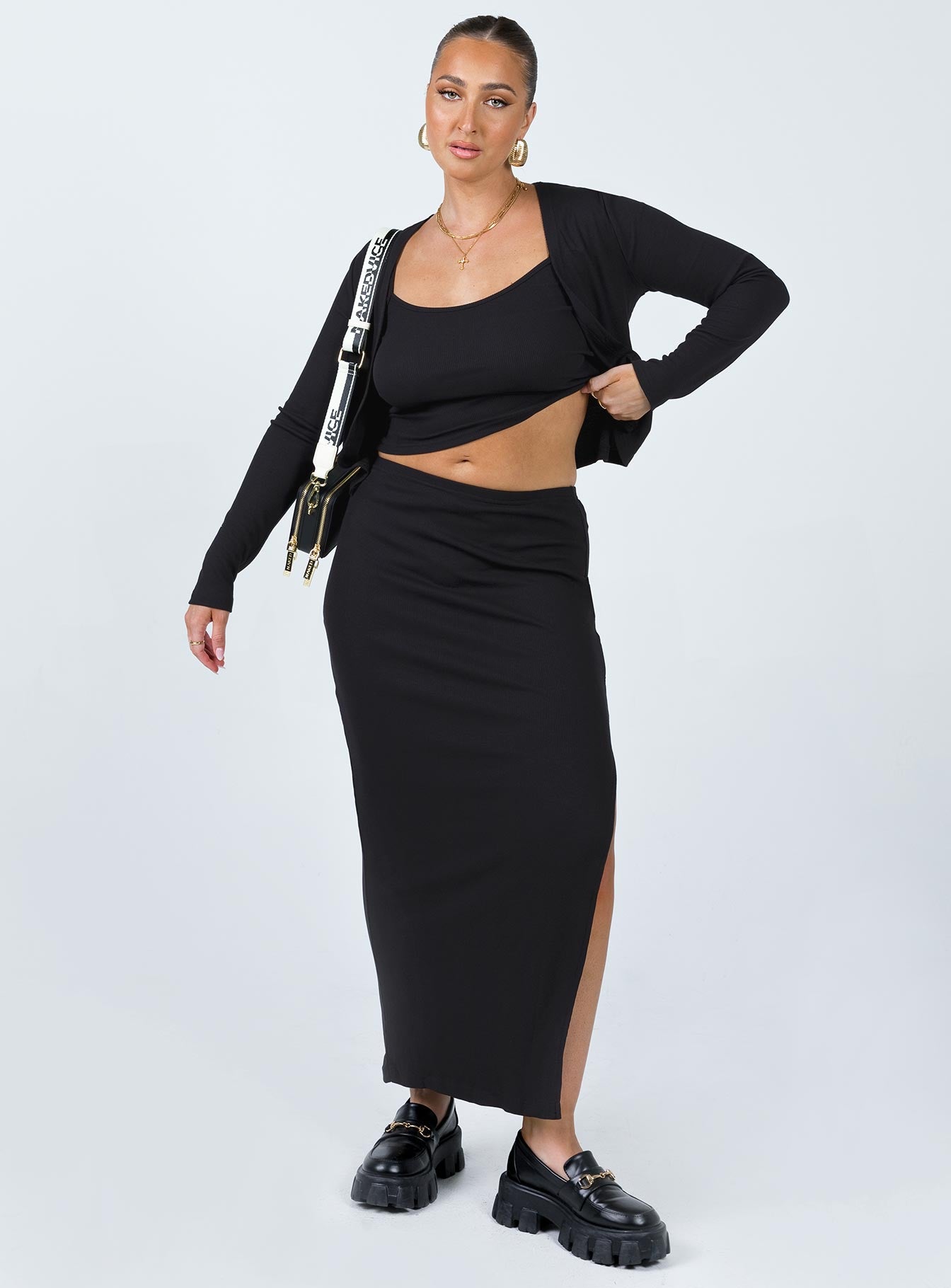 Matching three piece set Ribbed material Long sleeve cardigan  Button fastening at front Crop top Scoop neckline Adjustable shoulder straps Midi skirt Elasticated waistband Slit at side