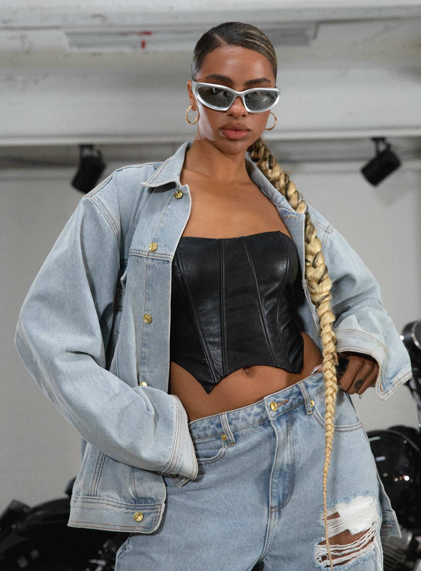 Denim jacket Light wash denim Classic collar Button fastening at front Four pocket design Gold-toned hardware Embroidered graphic at back