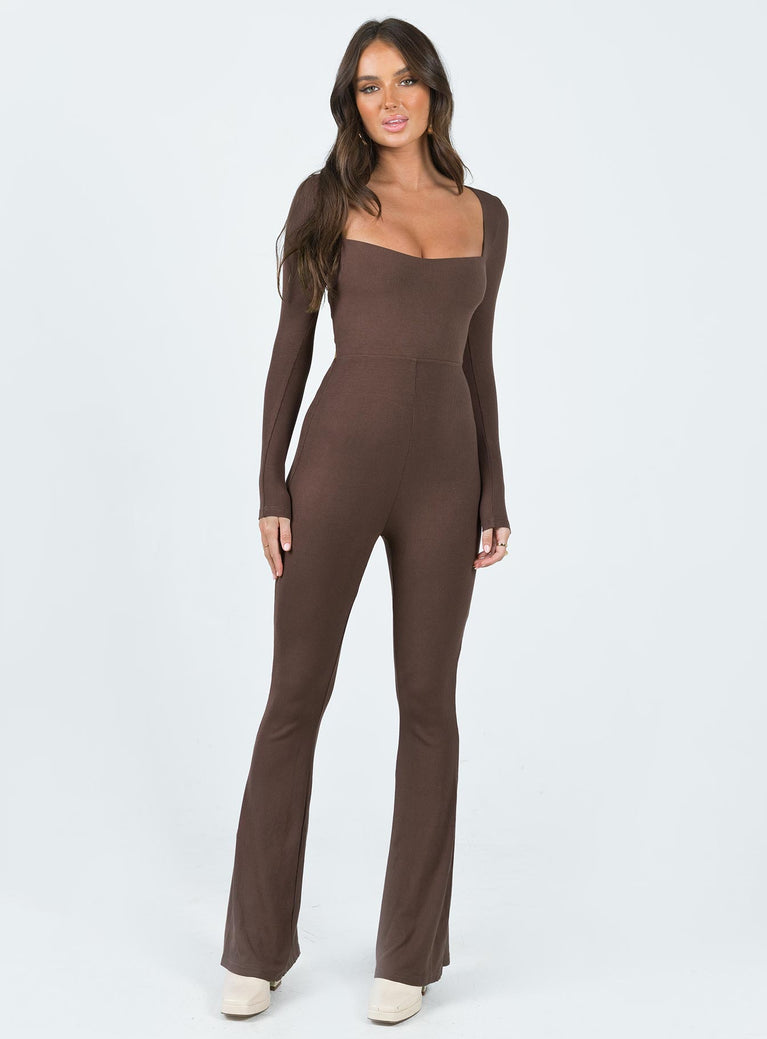 Long sleeve jumpsuit Ribbed material Square neckline Cut out at back with tie fastening Good stretch Partially lined