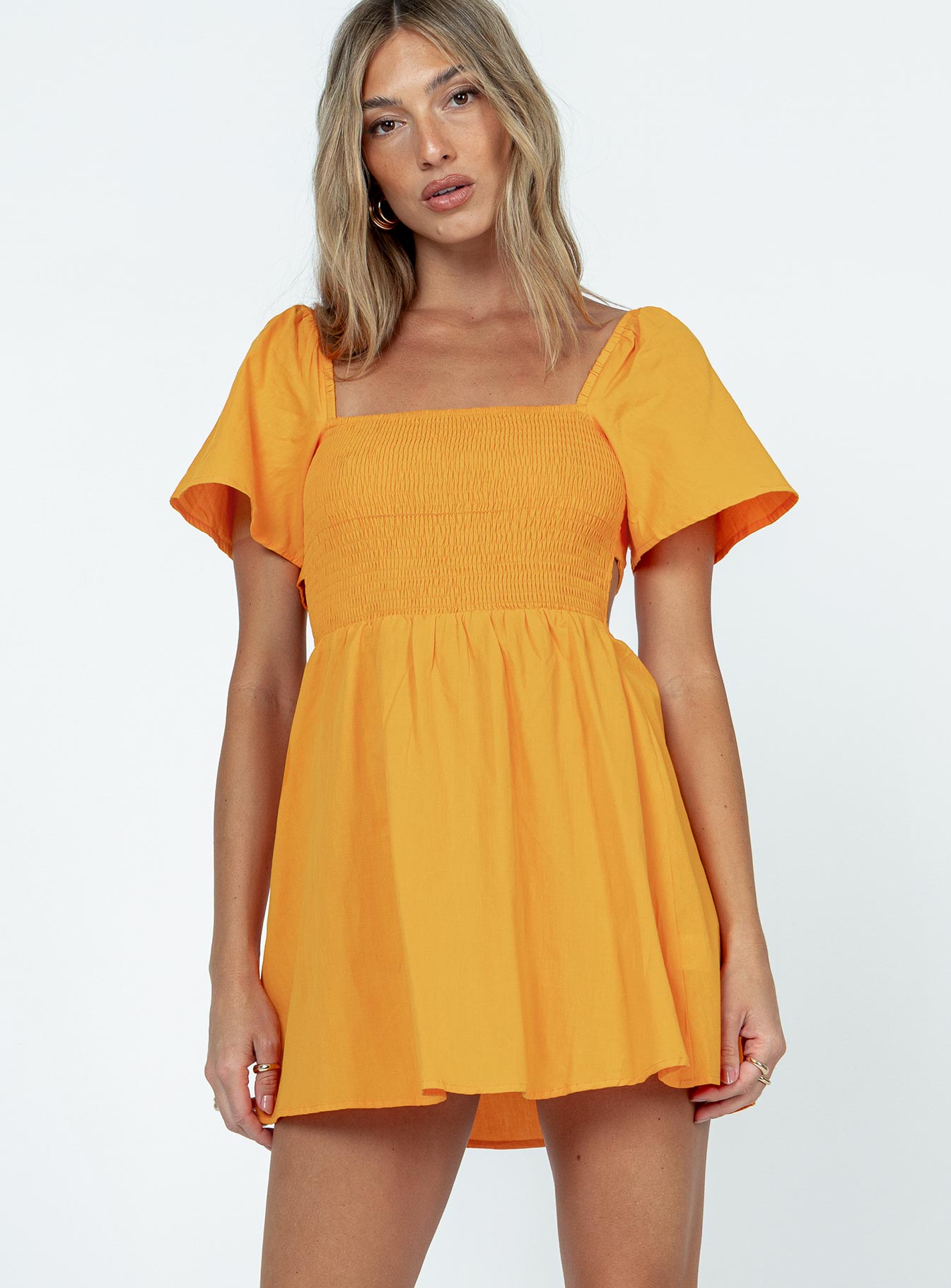 Front view of model wearing  front Princess Polly Square Neck  Summer Nights Mini Dress Orange