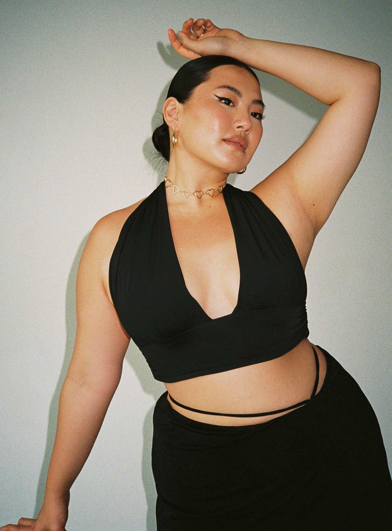 front view of model wearing Princess Polly Jordy Top Black Curve Eco Sleeveless Plunger 