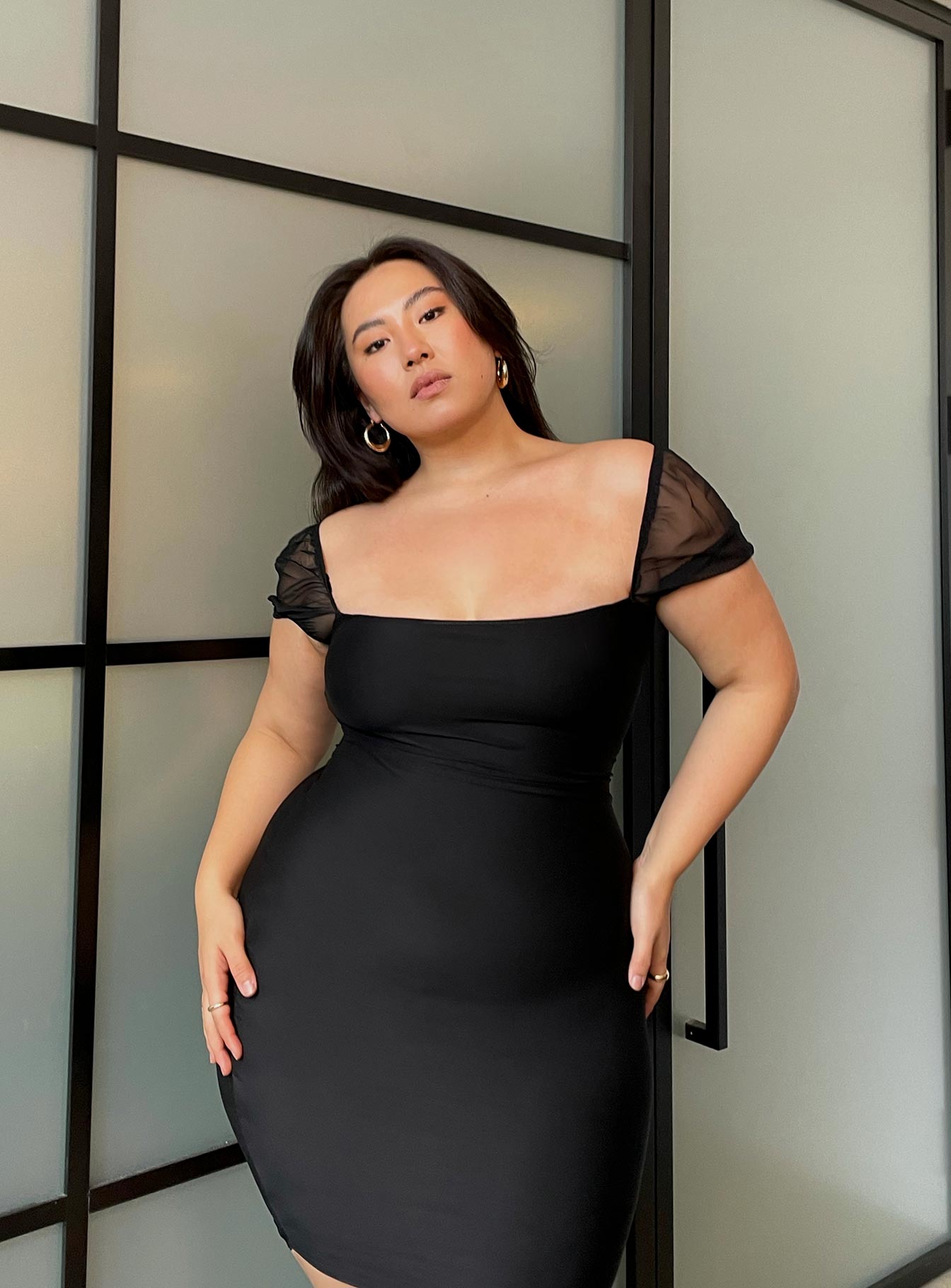 side view of model wearing Princess Polly Charvi Mini Dress Black Curve 