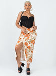 Midi skirt  100% polyester  Floral print  Crinkle material  Elasticated waistband  High side slit 