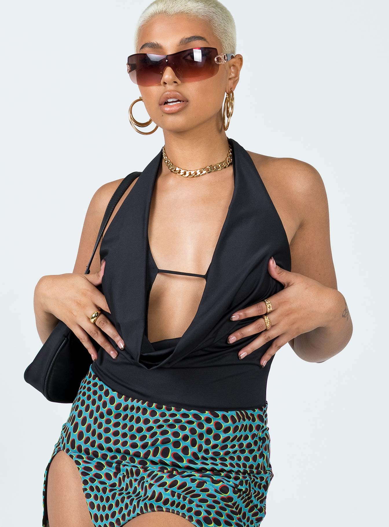 side view of model wearing Princess Polly Kayley Bodysuit Black Sleeveless Cowl 