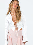 Long sleeve top Silky material Classic collar V-neckline Lace-up fastening at front Slit at cuff Pointed hem