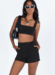 Black matching set Crop top Fixed straps Invisible zip fasting at side High waisted shorts Belt loops at waist Zip and button fastening Sutble pleats at waist Twin hip pockets Non stretch  Lined top