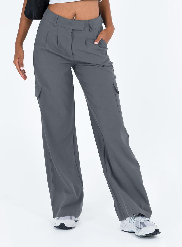 Tailored pants Low rise Belt looped waist Zip and clasp fastening  Pleats at waist Twin hip pockets Wide leg Extra cargo style leg pockets