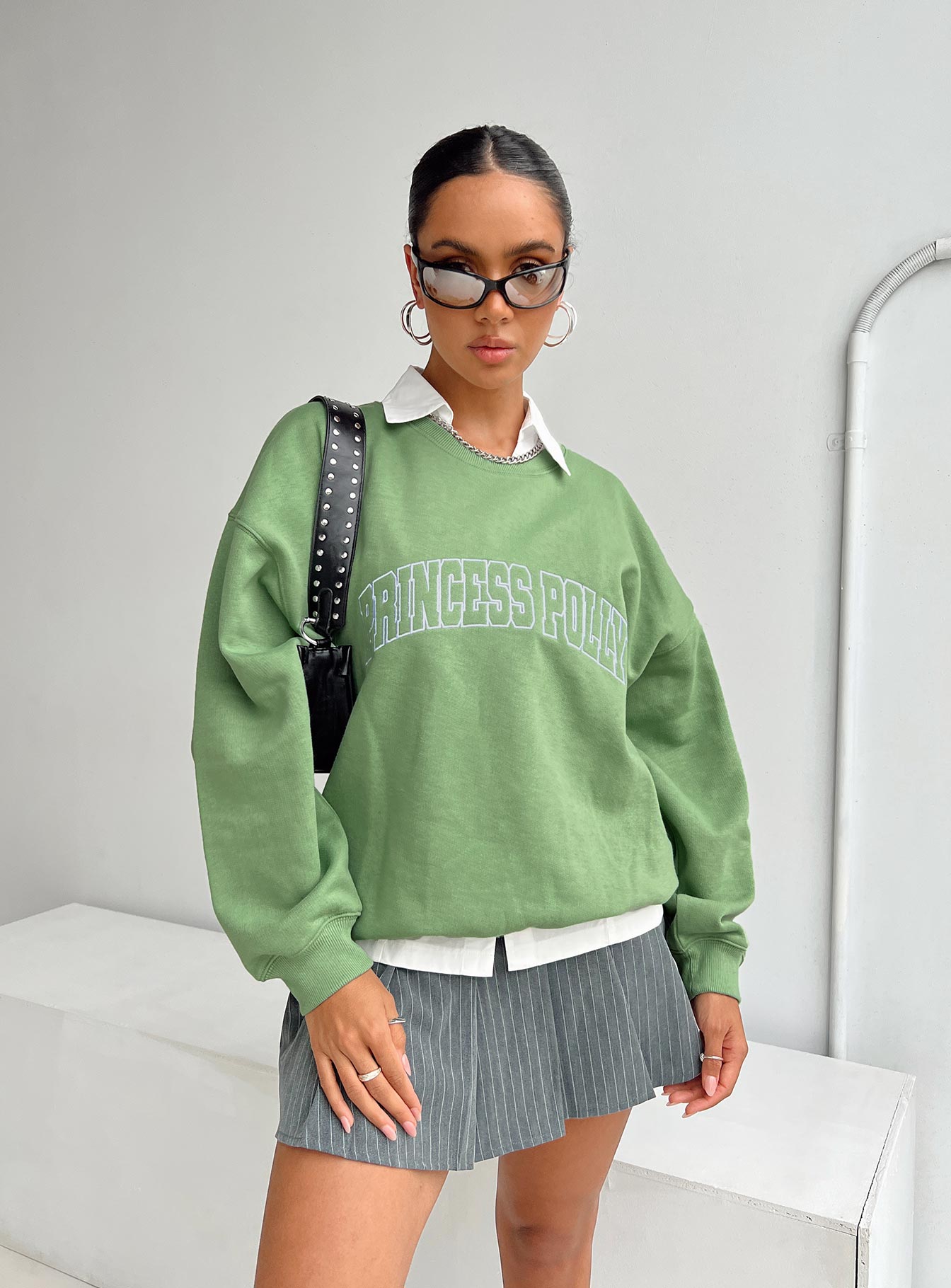 front view of model wearing Princess Polly Princess Polly Crew Neck Sweatshirt Collegiate Text Green 