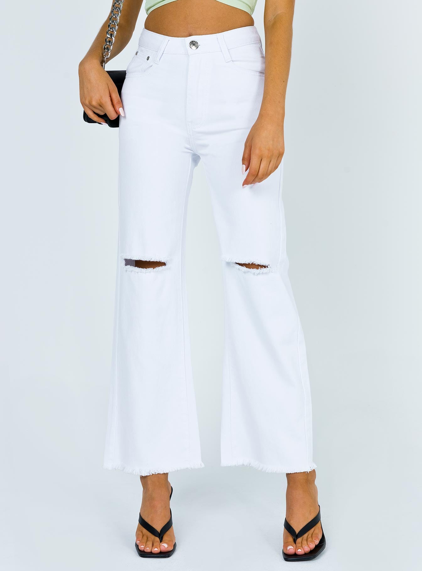 front view of model wearing Princess Polly Cece Hammer Wide Leg Knee Rip Jeans White Denim Mid Rise 