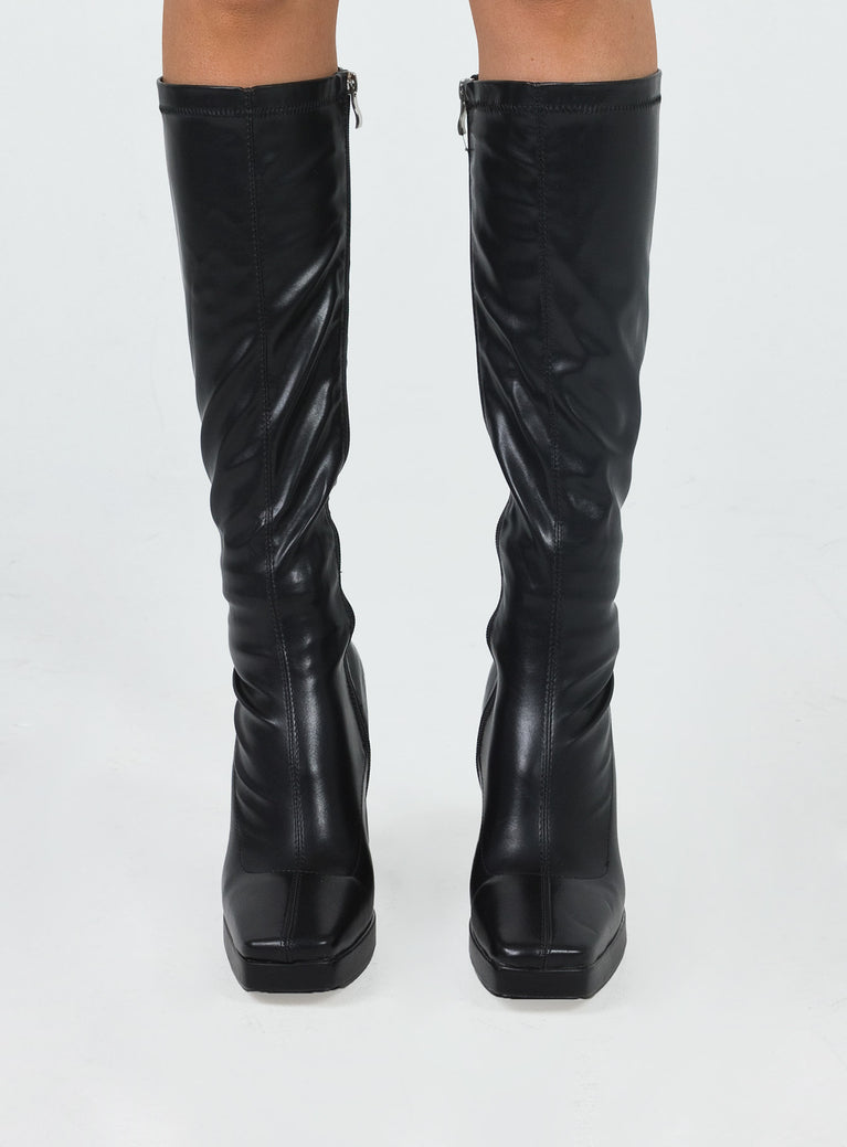 Knee-high boots Faux leather material Square toe Platform base Block heel Zip fastening at side Padded footbed