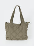 Tote Quilted material Twin fixed handles Zip fastening Internal slip pocket