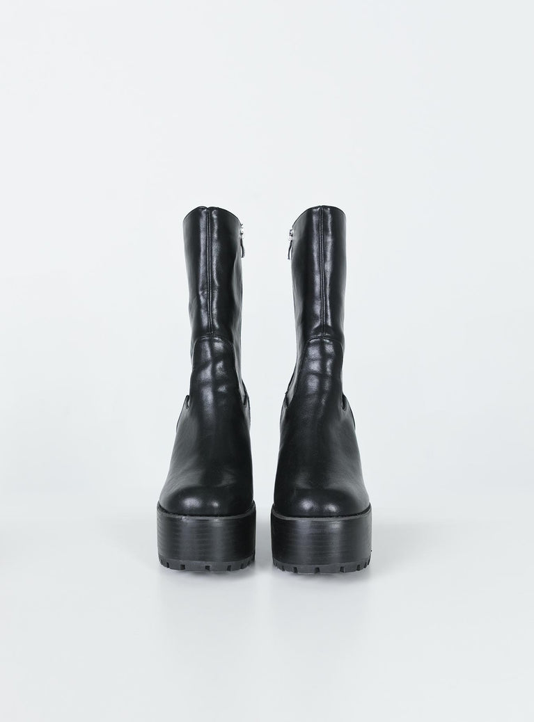 Boots Faux leather material  Mid-calf length  Zip fastening at side  Rounded toe Platform base  Block heel  Treaded sole