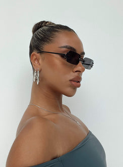 Sunglasses Frameless Black tinted lenses Slim arms Silicone nose pads