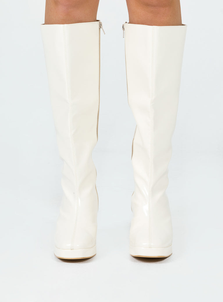 Cream knee high boots Faux glossy leather  Zip fastening at side  Block heel  Rounded toe 