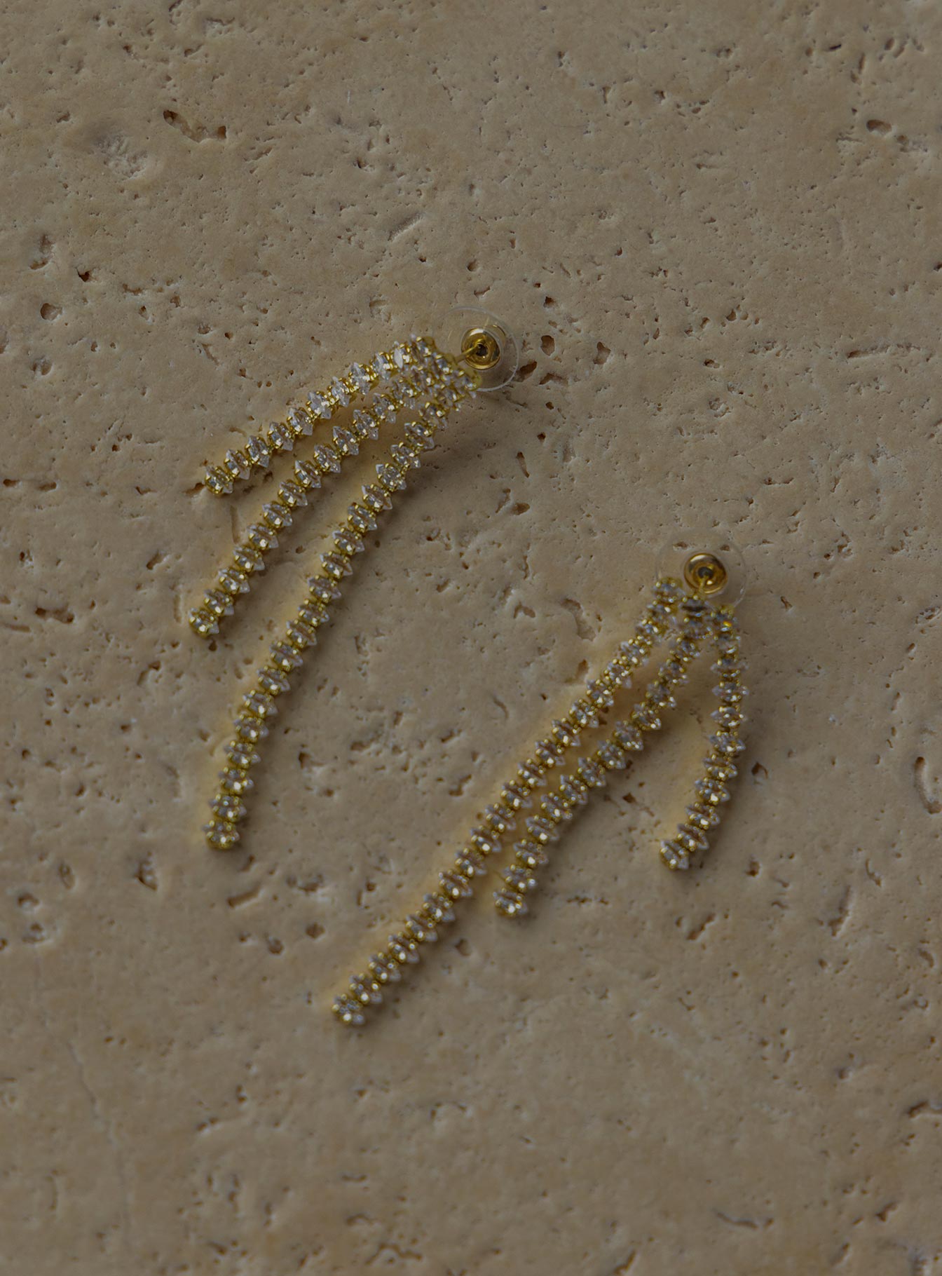 Earrings  60% brass 40% glass Stud fastening  Drop chains  Diamante design 