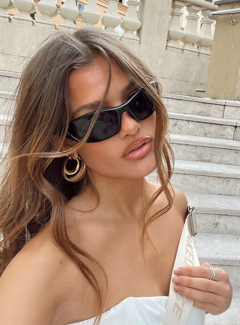 Sunglasses Wrap around design Light weight frame Black tinted lenses Moulded nose bridge