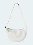 White crossbody bag Nylon material Adjustable strap Zip fastening Internal slip pocket Silver toned hardware