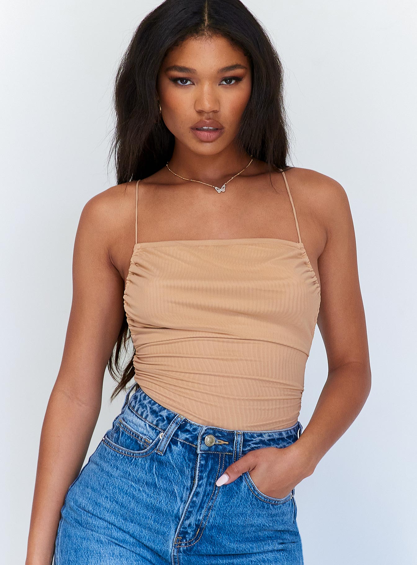 front view of model wearing Princess Polly Maverick Ruched Bodysuit Beige Sleeveless Square Neck 