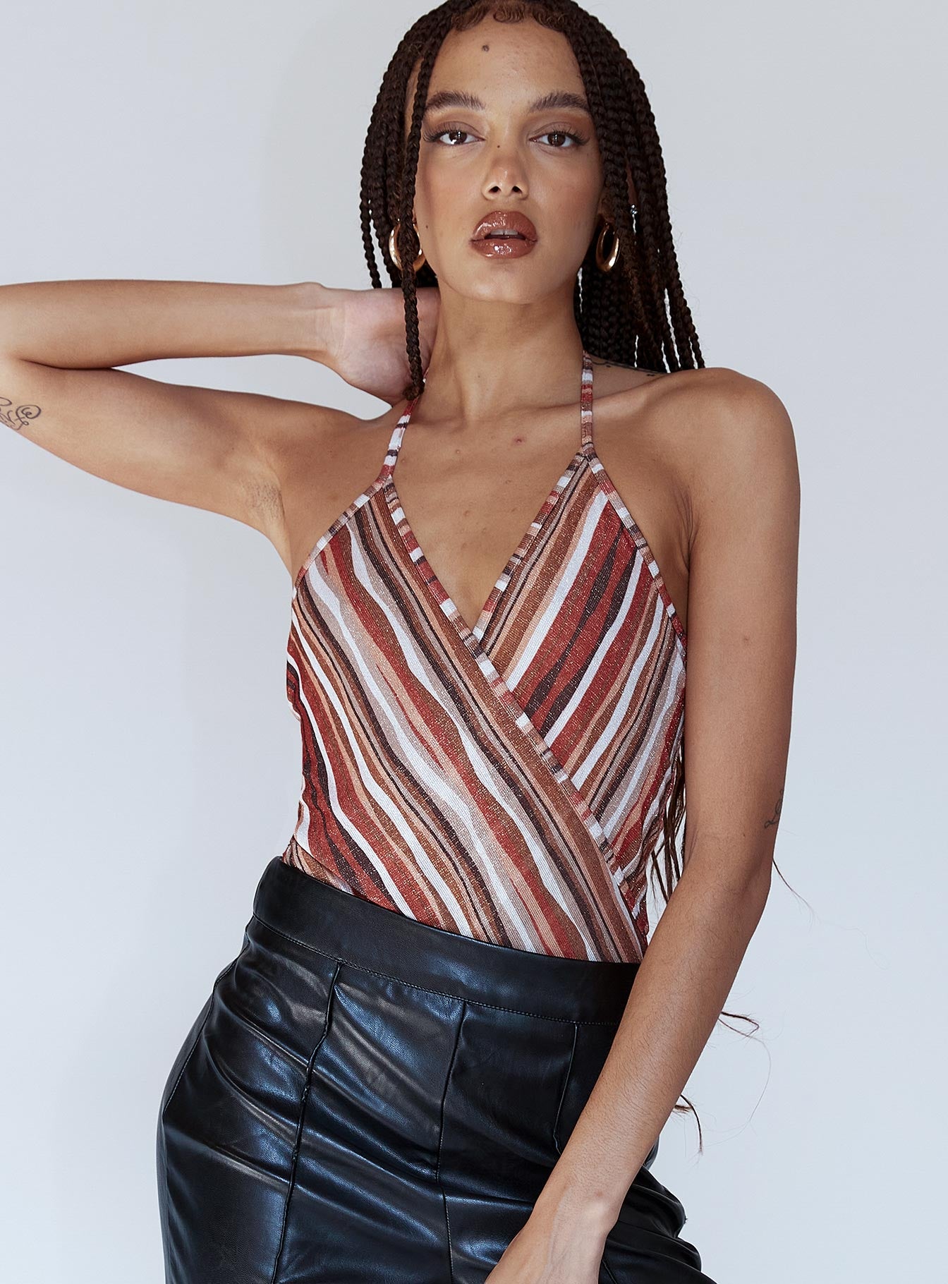 front view of model wearing Princess Polly Quinn Bodysuit Orange Multi Sleeveless V-Neck 