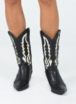 Cowgirl boots Faux leather material  Detail stitching  Mid-calf length  Pull tabs  Pointed toe Block heel 