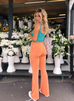 front view of model wearing Princess Polly True Heart Pants Orange 