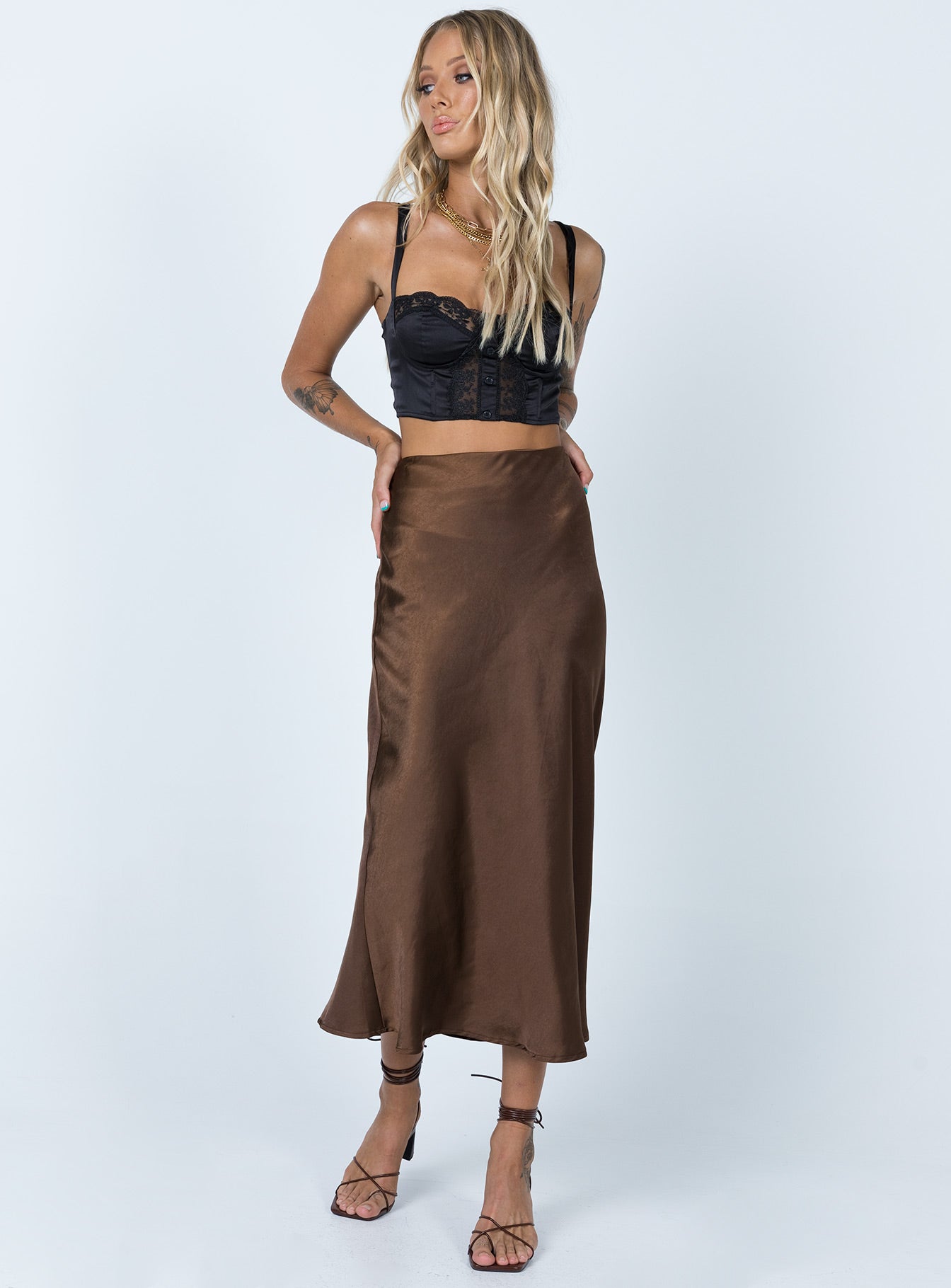   front view of model wearing Princess Polly Tyra Satin Midi Skirt Brown 