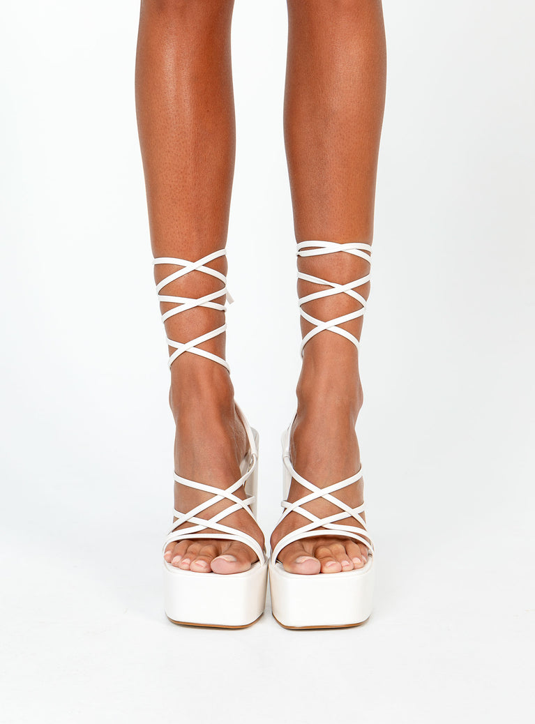 White heels Faux leather material  Strappy upper  Ankle tie fastening  Platform base  Block heel  Square toe 