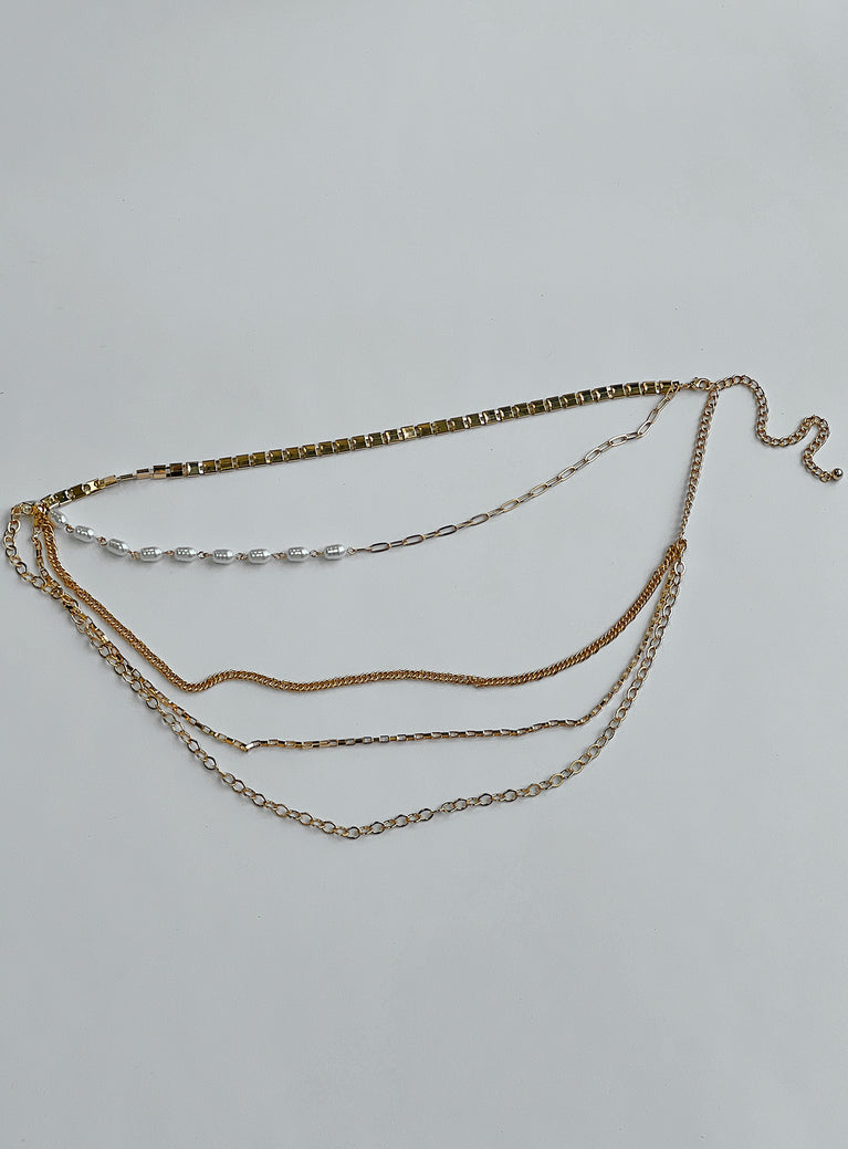 Gold toned chain belt Asymmetrical design Lobster clasp fastening Pearl detail