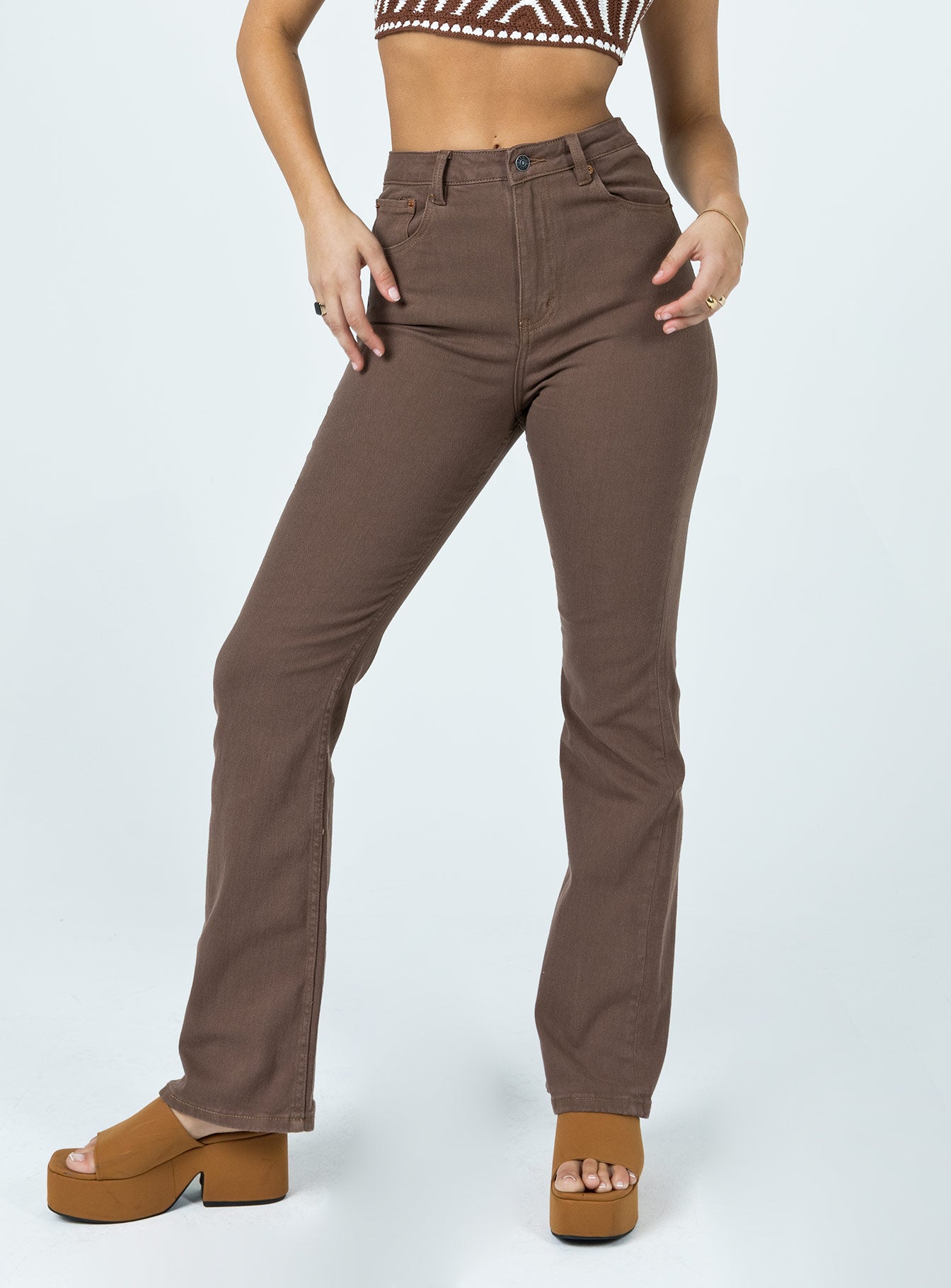 front view of model wearing Princess Polly Motel Bootleg Jeans Rich Brown High Waisted 