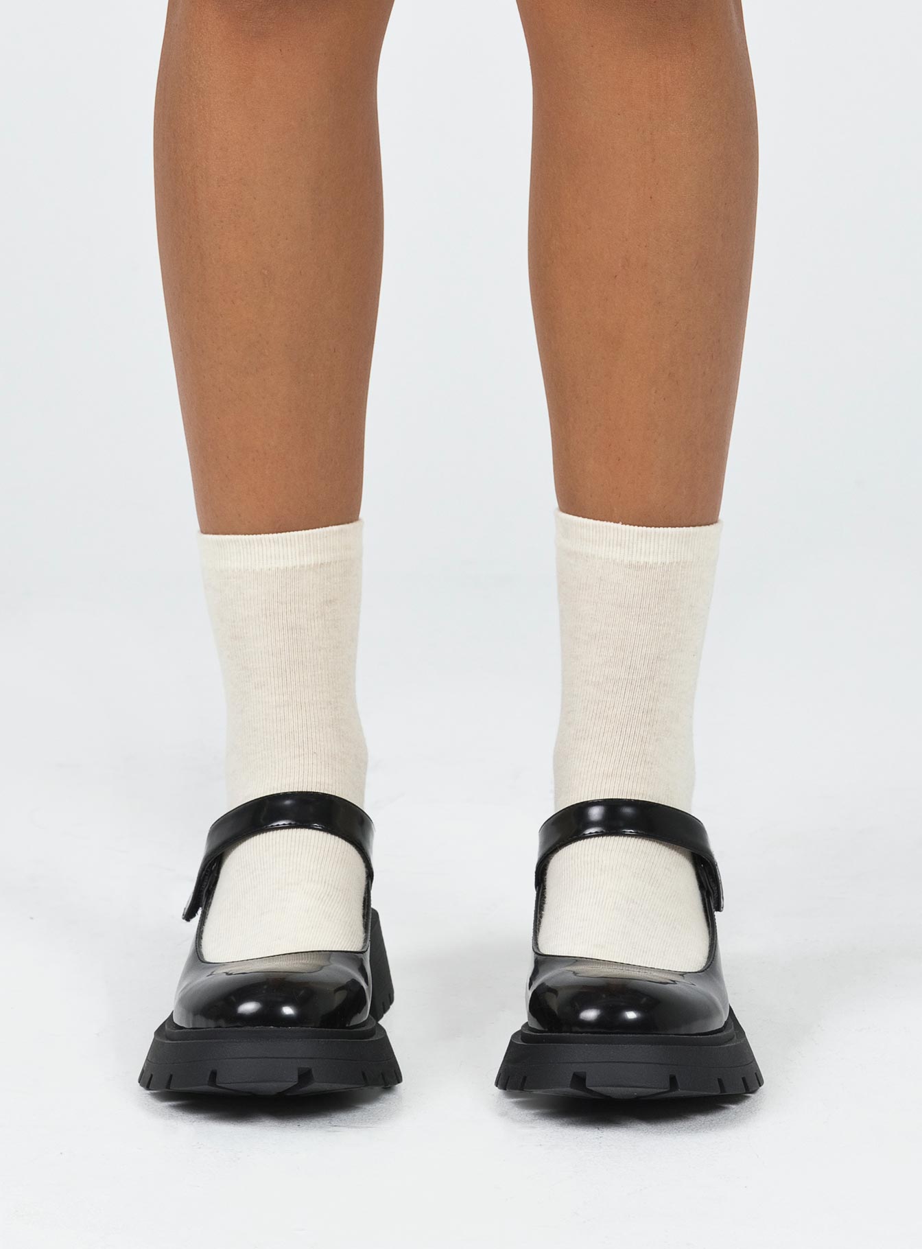 Loafers Faux patent leather Platform base Velcro fastening strap Rounded toe Treaded sole Padded footbed