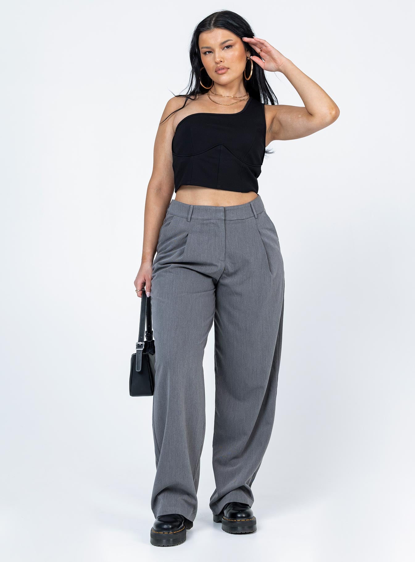 front view of model wearing Princess Polly Meranti Top Black Sleeveless Asymmetric Neckline 