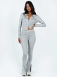 Two piece set Ribbed knit material Long sleeve top Front button fastening Flared pants Elasticated waistband Good Stretch