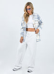 Oversized shirt Soft flannelette material Plaid print Button front fastening Twin chest pockets Single button cuff