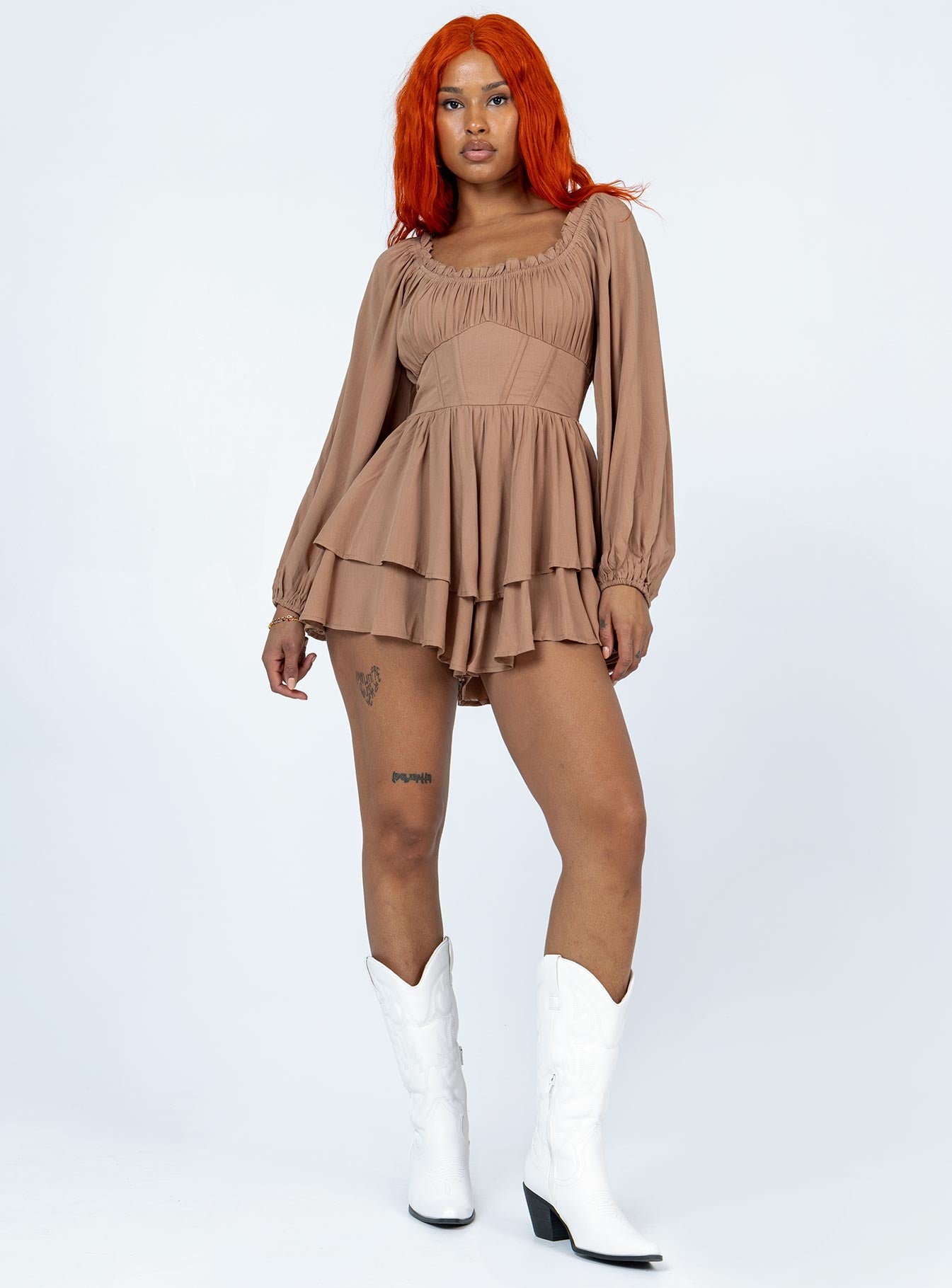 Romper Elasticated neckline  Boning through waist Shirred waistband at back  Layered skirt 