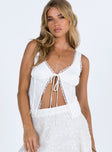 White top Textured material Lace trim at neckline and hem Tie fastening at front