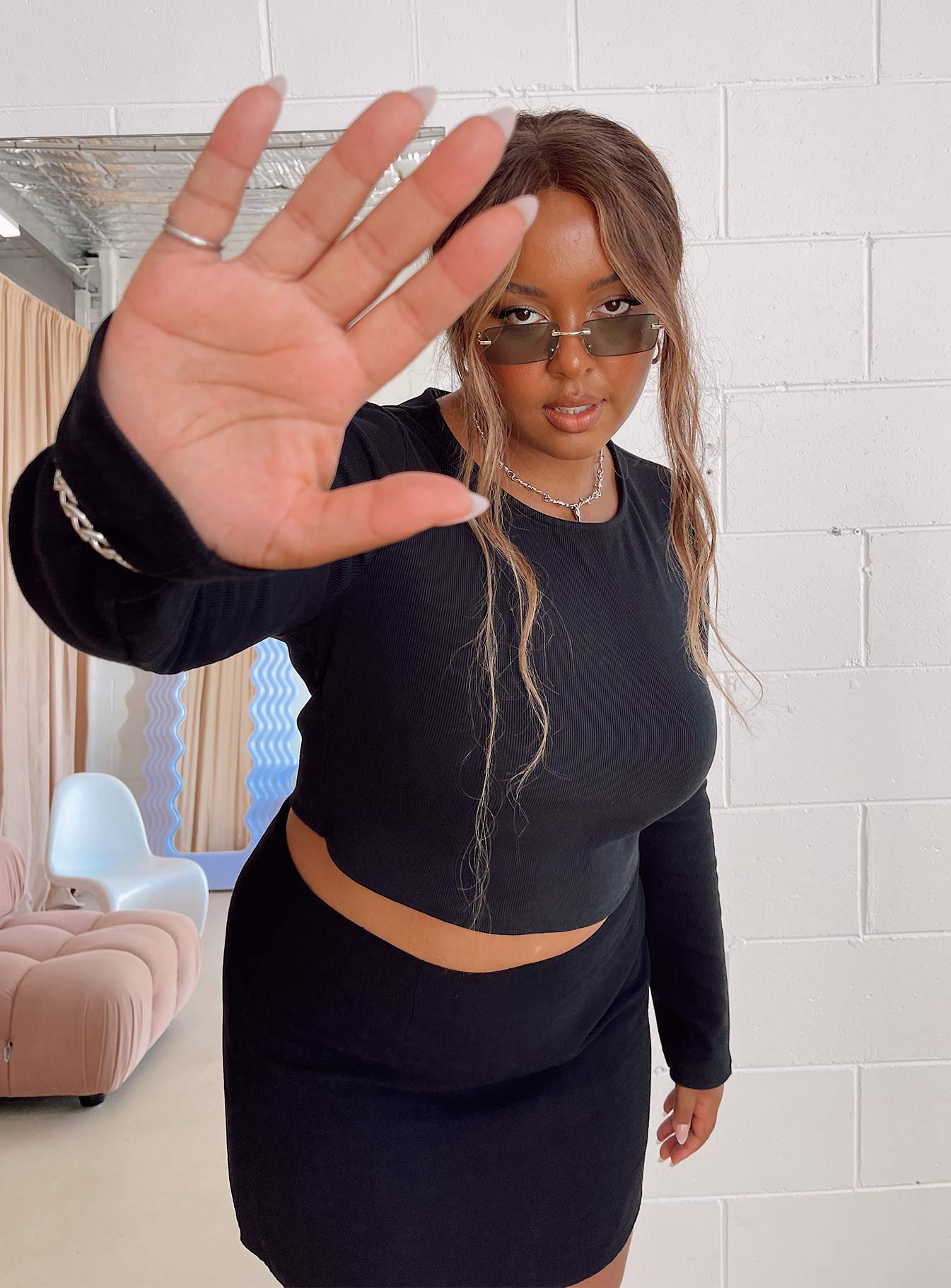 Front view of model wearing  front Princess Polly Full Sleeves High Neck  Classic Long Sleeve Crop Tee Black Curve