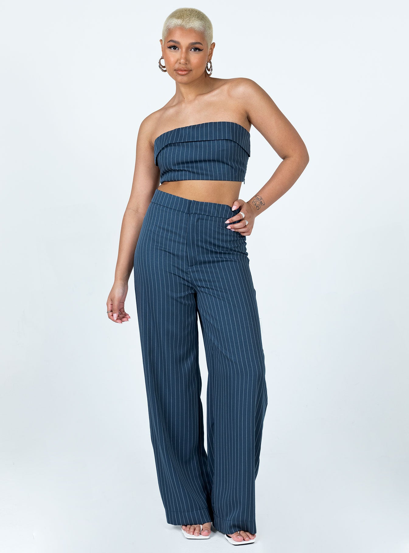 Matching set Pinstripe print Crop top Folded neckline Inner silicone strip at bust Invisible zip fastening at side Shirred back panel Tailored pants Hook & zip fastening Wide leg