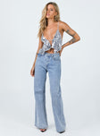 Crop top Adjustable shoulder straps Open front design Tie fastening at back Split hem