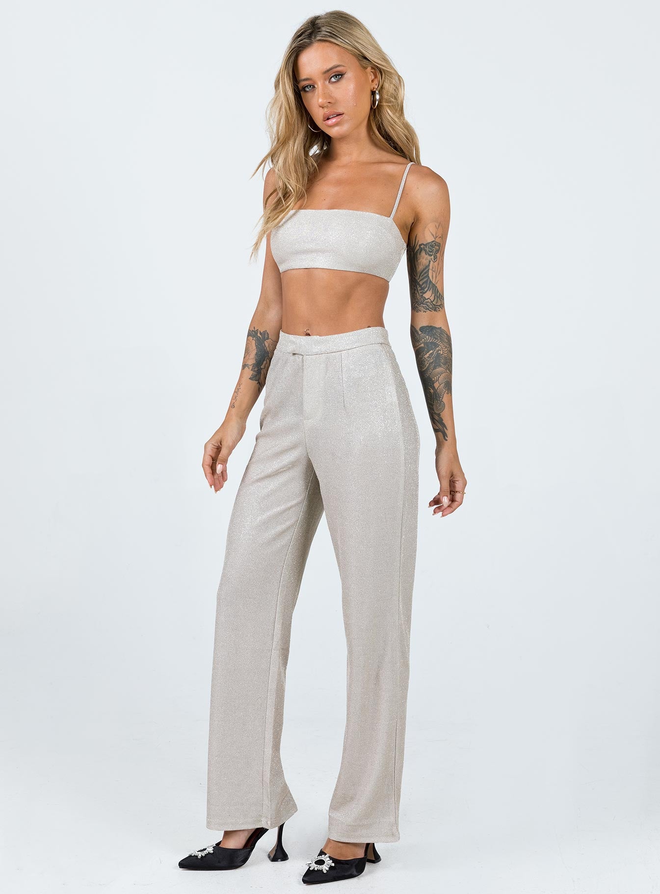 Matching set Sparkly material Crop top Adjustable shoulder straps Zip fastening at back Pants High rise Zip & clasp fastening  Subtle pleats at waist Straight leg