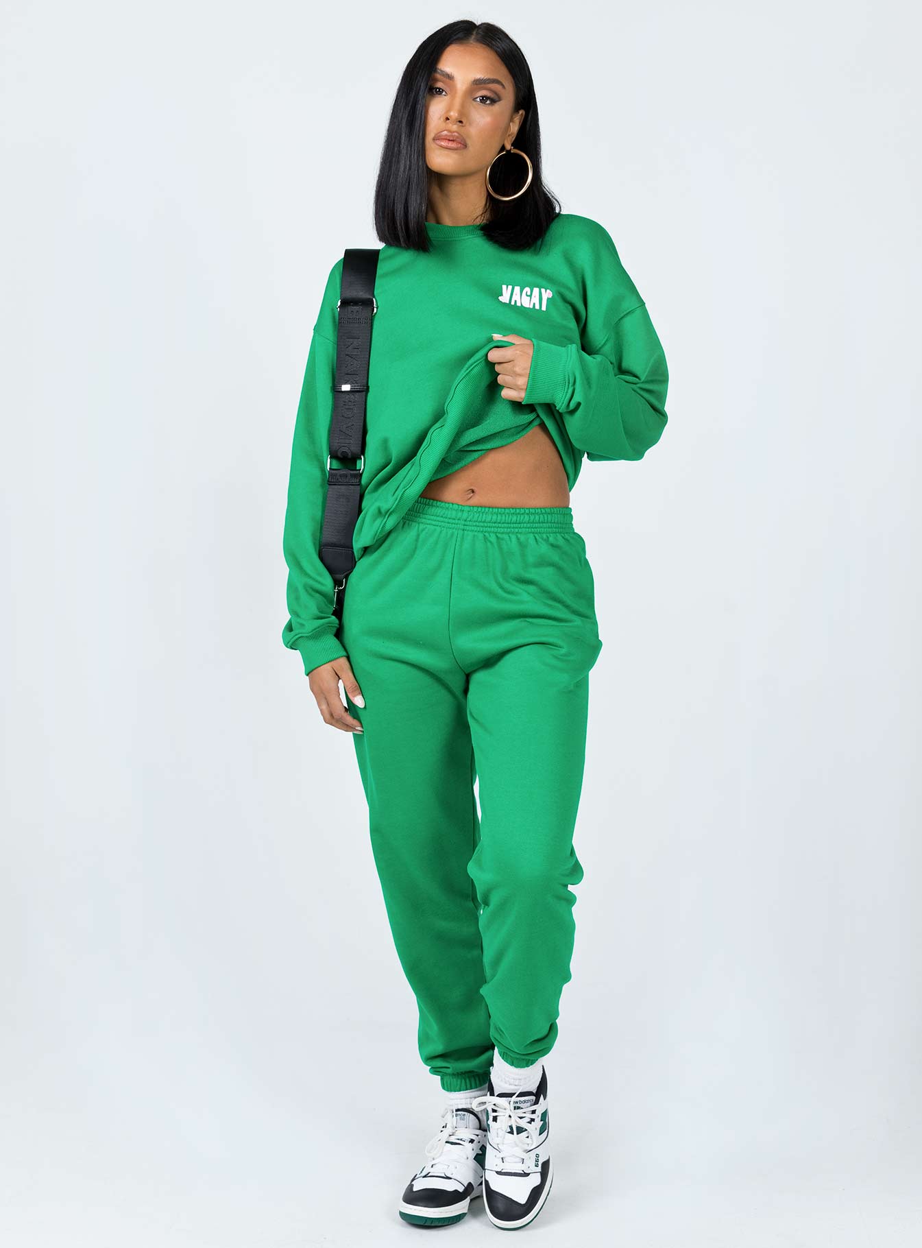 front view of model wearing Princess Polly Club Basic Trackpants Green 