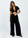 Jumpsuit Tie front fastening  Cut out midriff  Elasticated waistband  Wide leg 