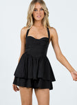 Romper Halter neck tie Elasticated back band Invisible zip fastening at back Relaxed leg Layered hem