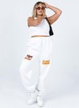 front view of model wearing Princess Polly Jasmine Graphic Track Pants White 