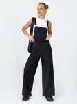 Overalls Oversized fit Pinstripe print  Adjustable shoulder straps  Single chest pockets  Belt looped waist  Four classic pockets  Invisible zip fastening at side  Wide leg 