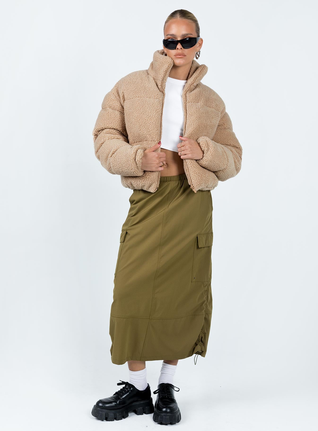 Puffer jacket Sherpa material  Turtle neck Zip fastening at front  Twin hip pockets  Fully lined 