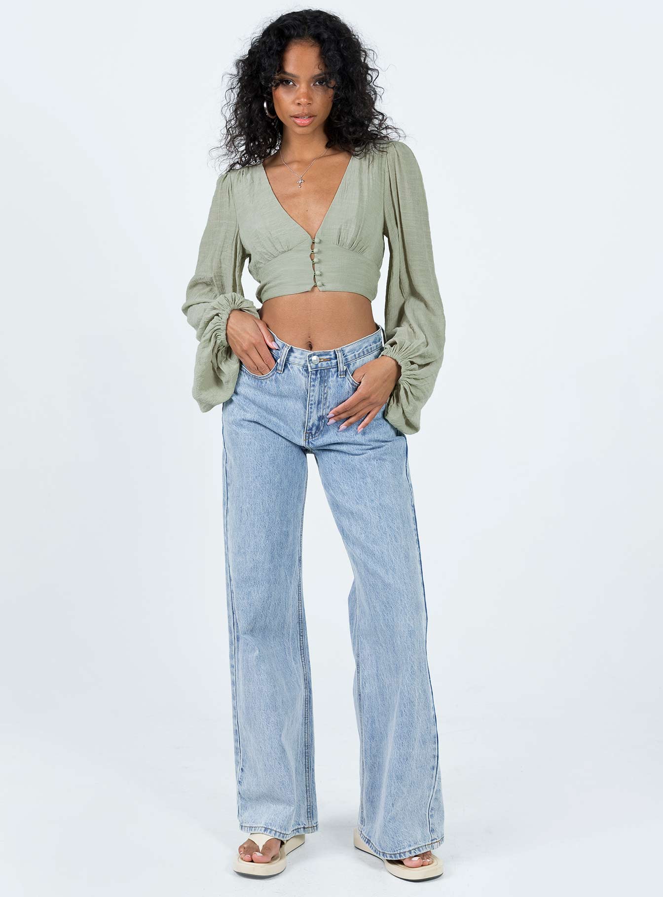 Front view of model wearing  front Princess Polly Full Sleeves Square Neck  Castlereagh Top Green